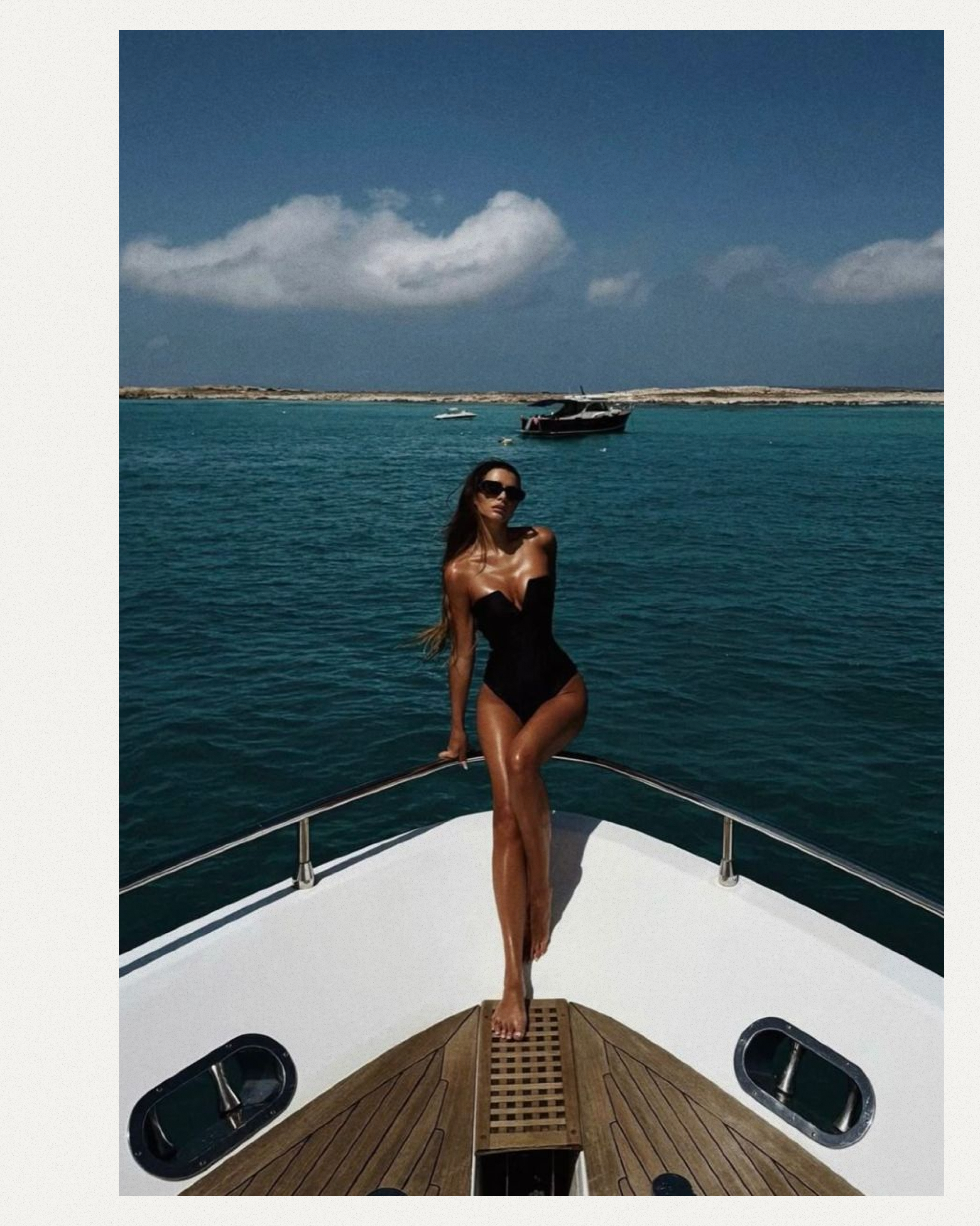 Woman looking at the sea from a yacht bow